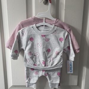 2 Carter's Baby Outfits. One with Apple Print other Plain Pink
